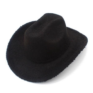 Detail shot of the plush black fleece texture on a wide-brimmed western cowboy hat