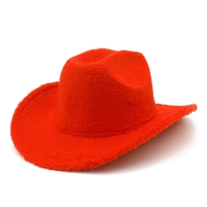 Detailed view of bright orange fuzzy fleece western cowboy hat with upturned brim