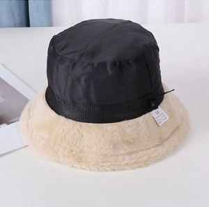 Detail showing the inner wash label and dual-material stitching of the bucket hat
