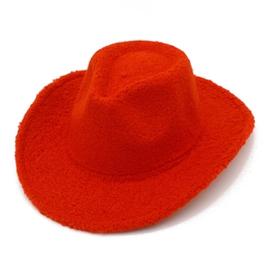 Western style bright orange teddy faux fur cowboy hat with a wide brim and textured finish