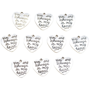 10-piece set of heart-shaped DIY alloy pendants with engraved quote on white background