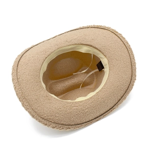 Detail view of khaki faux fur cowboy hat interior with adjustable drawstring and lining