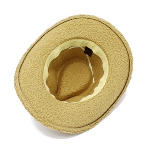Detail view of khaki faux fur cowboy hat interior with adjustable strap and care label
