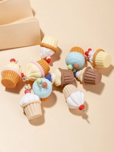 Detailed close-up of colorful resin cupcake charms with metal loops for DIY jewelry
