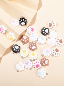 Detailed view of colorful resin cat paw pendants with metal hooks for DIY jewelry