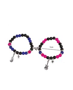 Detail of magnetic heart clasp on guitar star beaded bracelets for couples