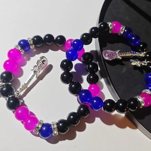 Matching couple beaded bracelets with silver guitar pendants and star magnetic charms