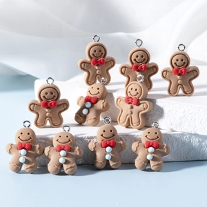 Cartoon resin gingerbread man charms with red bows and silver loops for DIY jewelry