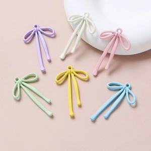 Colorful matte bow-shaped alloy pendants for DIY jewelry making in six pastel shades