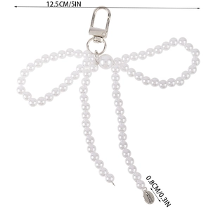Dettaglio del fiocco di perle fatto a mano con dimensioni e incisione Hand Made