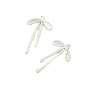 DIY cream white alloy bow pendant for handmade necklaces and earrings set on white background