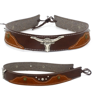 Detail of dark brown leather collar with silver bull head charm and white stitching