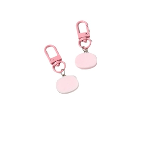 Pair of cute pink resin pig-shaped keychains with matte finish and metal lobster clasps