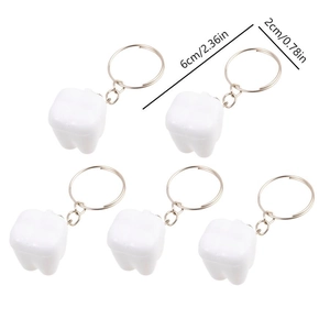 5-piece set of white tooth-shaped keychains with gold rings and 6cm size label