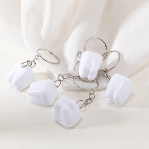 Set of 5 molar shaped tooth keychains made of white resin with silver metal chains