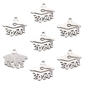 Macro detail of 2024 graduation cap charms in antique silver finish for DIY jewelry