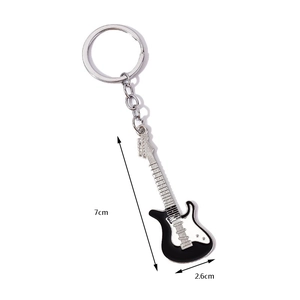 Mini electric guitar keychain in black and white metal, dimensions 7cm by 2.6cm