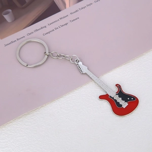 Mini electric guitar keychain accessory in red and black metal finish with silver ring