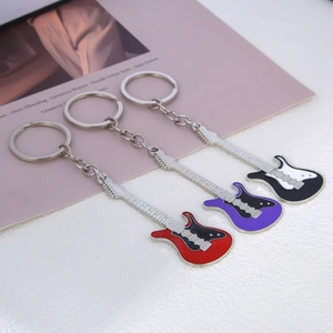 Mini metal electric guitar keychains in red, purple and white with polished finish