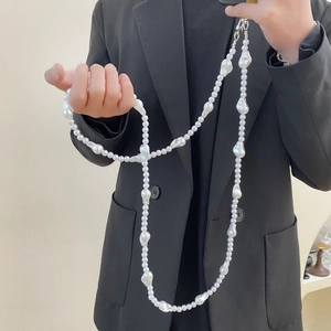 Detailed view of Baroque irregular pearl crossbody chain with silver lobster clasp hook