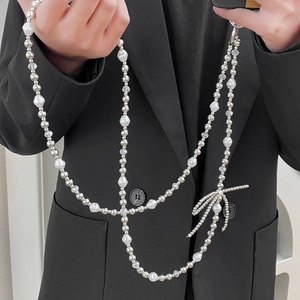 Elegant beaded crossbody phone strap with white baroque pearls and silver bow charm