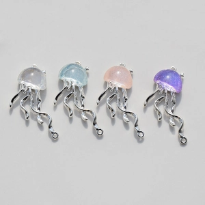 Detailed view of colorful jellyfish pendants in silver, blue, pink, and purple resins