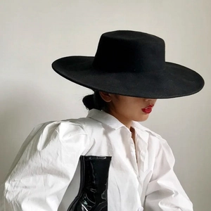 Classic black wool felt boater hat with a wide flat brim featuring a stylish French vintage design