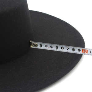 Detail showing measurement of the 10cm wide brim on a black vintage felt fedora hat