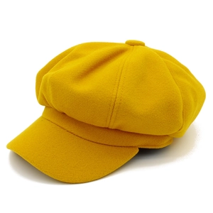 Klassische leuchtend gelbe Newsboy-Mütze aus Wolle mit warmer Vintage-Textur