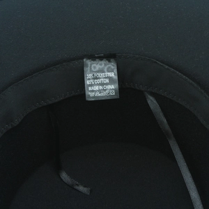 Detail view of the interior washing label showing 65% cotton and 35% polyester fabric