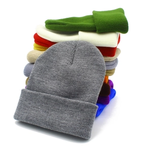 Detailed view of knitted beanies in multiple colors with a premium elastic texture