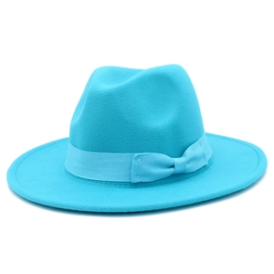 Close-up of vibrant cyan wide brim fedora hat showing textured felt and ribbon detail