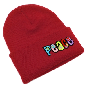 Red knit beanie with Peace embroidery and floral accents for autumn and winter warmth