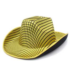 Close-up of a glittering gold and black checkered disco cowboy hat with a curved brim