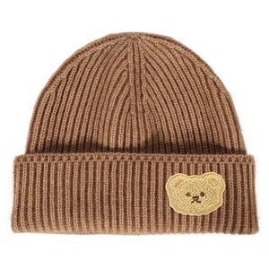 Detail of ribbed knit beanie with small plush teddy bear patch in caramel brown