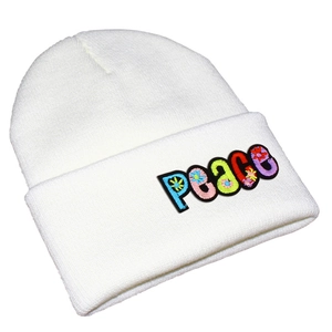 Close-up of multicolor PEACE letter embroidery on white ribbed knit beanie cuff