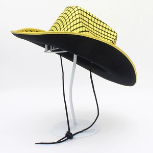 Detail view of yellow cowboy hat with black plaid pattern and adjustable windproof cord