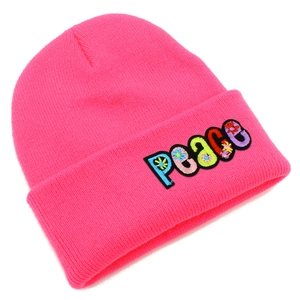 Detail of hot pink knit beanie showing colorful PEACE embroidery with floral patterns