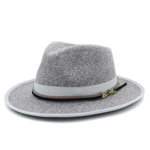 Detail of gray wool fedora hat featuring layered belts and a gold horsebit buckle