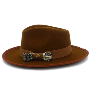 Close-up of wool fedora hat featuring paisley patterned bow and vintage metal buckle