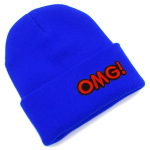 Detail of royal blue ribbed knit beanie with red and black OMG! letter embroidery