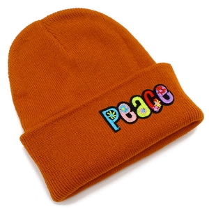 Burnt orange knit beanie with colorful PEACE letter embroidery for winter warmth