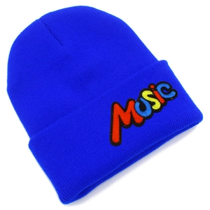 Detailed close-up of rainbow MUSIC embroidery on a bright royal blue knit beanie hat