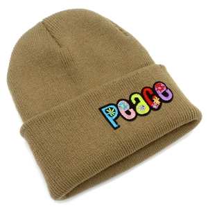 Close-up of khaki knitted beanie featuring PEACE embroidery with floral letter patterns