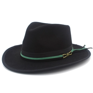 Detail of wool felt fedora with black ribbon, green cord, and gold horseshoe buckle