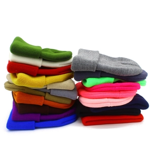 Detailed view of assorted colors for these thick knitted cuffed beanie hats for adults