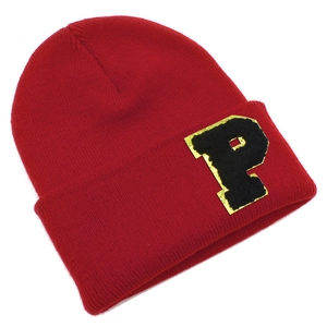 Detail shot of a red knit beanie featuring a vintage varsity P letter patch embroidery
