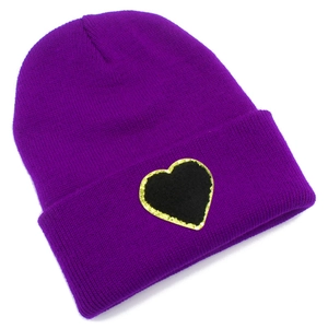 Purple knitted beanie with black heart patch and gold glitter edges on white background