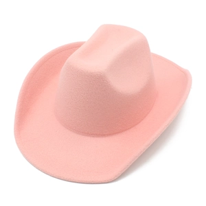 Detail of pink felt cowboy hat showing rolled brim and soft wool texture on white background