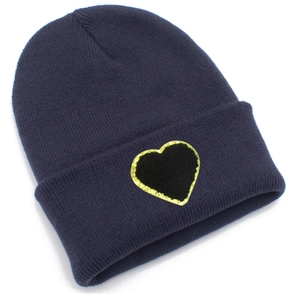 Detailed view of navy blue knitted beanie featuring a sequined black heart patch detail